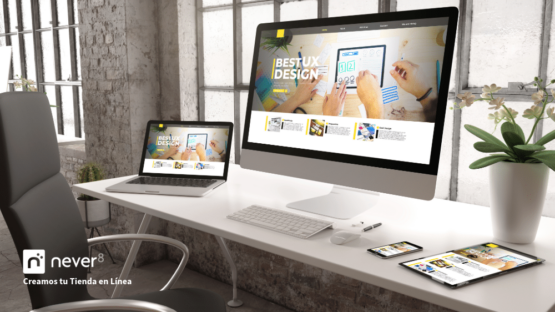 Modern workspace with desktop, laptop, tablet and smartphone showing the design of an online store, representing the process of creating and configuring online stores guided by experts like Never8.