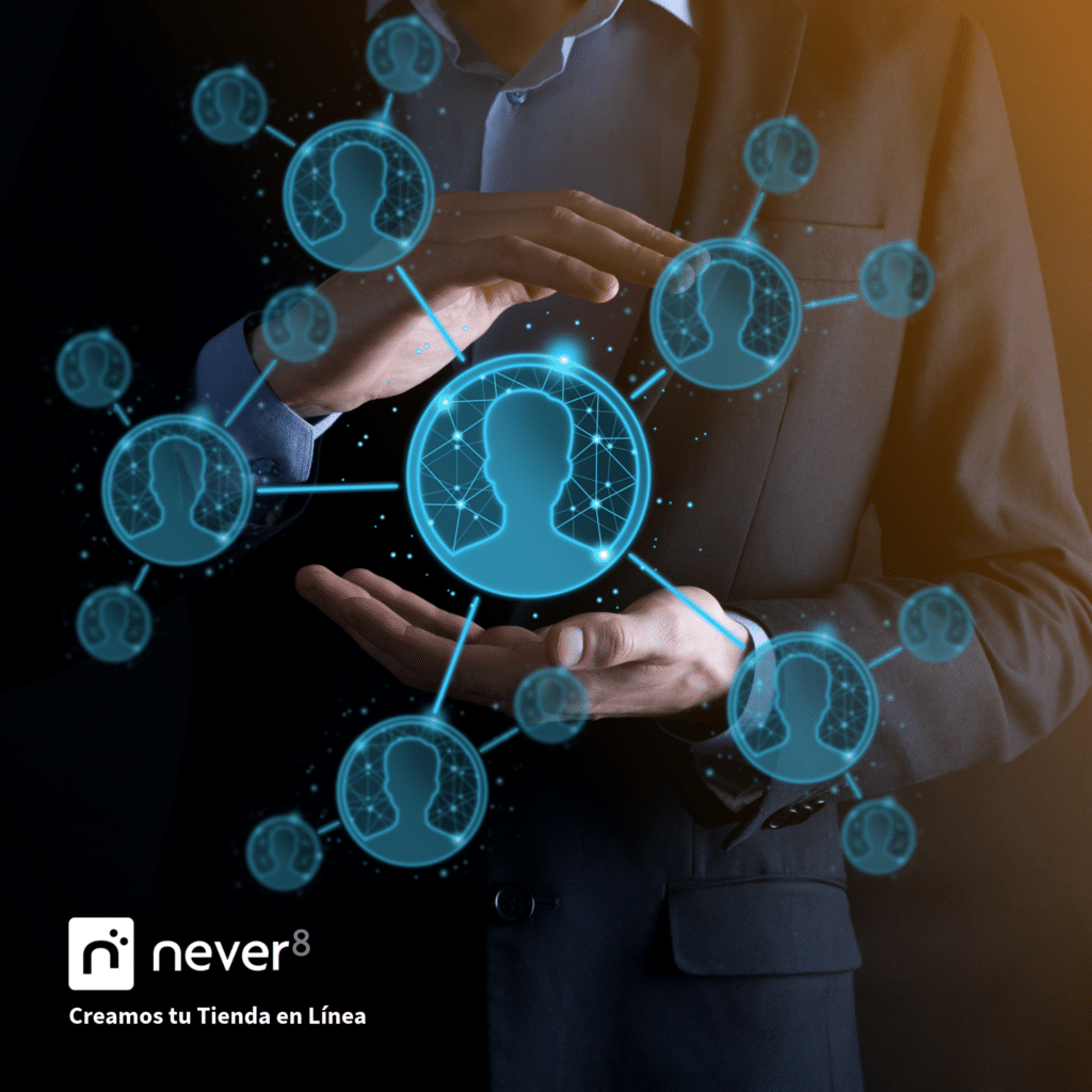 Imagen de manos protegiendo un ícono de persona en el centro, rodeado de múltiples perfiles conectados, simbolizando la segmentación de clientes. Never8, como agencia de ecommerce especializada en Adobe Commerce, te ayuda a optimizar la personalización identificando segmentos según intereses, historial de compras y datos demográficos. Además, te apoya en la creación de promociones adaptadas y en la automatización de campañas para ofrecer a cada cliente ofertas en el momento ideal.