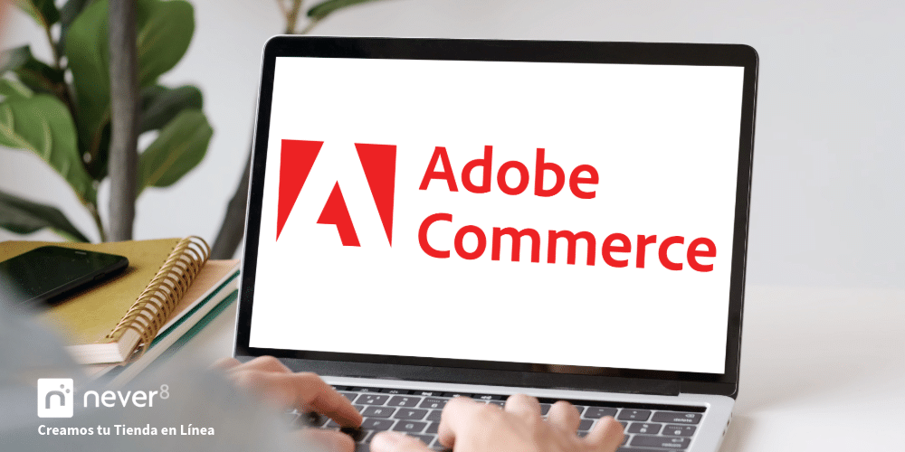 Laptop displaying the Adobe Commerce logo, highlighting its ability to create customized, scalable online stores. Never8 makes it easy to implement and manage this advanced e-commerce platform.